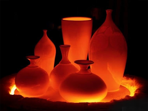 image of five custom ceramic pieces being fired in a kiln